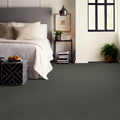greenish-grey carpet in bedroom
